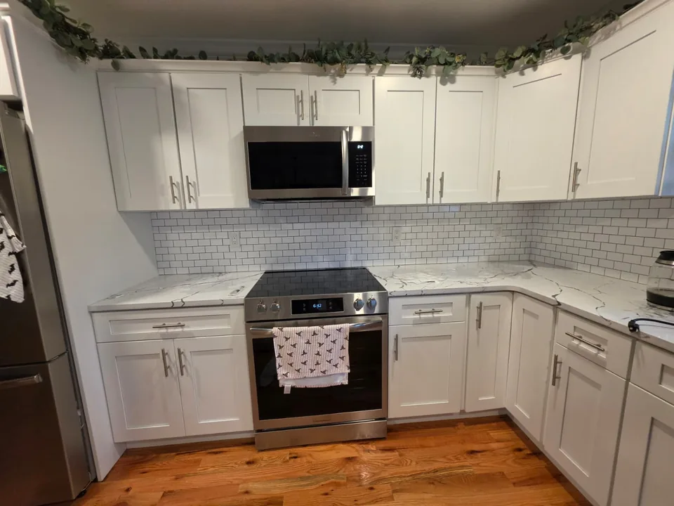 White tile backsplash above a kitchen countertop