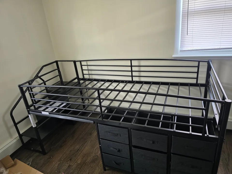 Assembled black metal bed frame with storage drawers