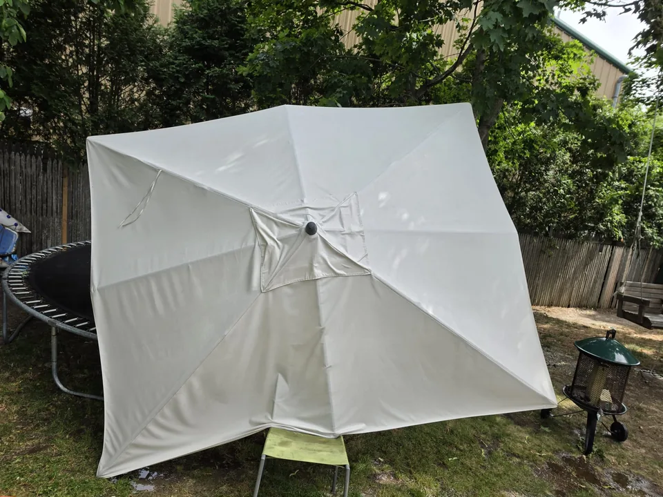 Outdoor umbrella canopy shown as a pressure-washing project